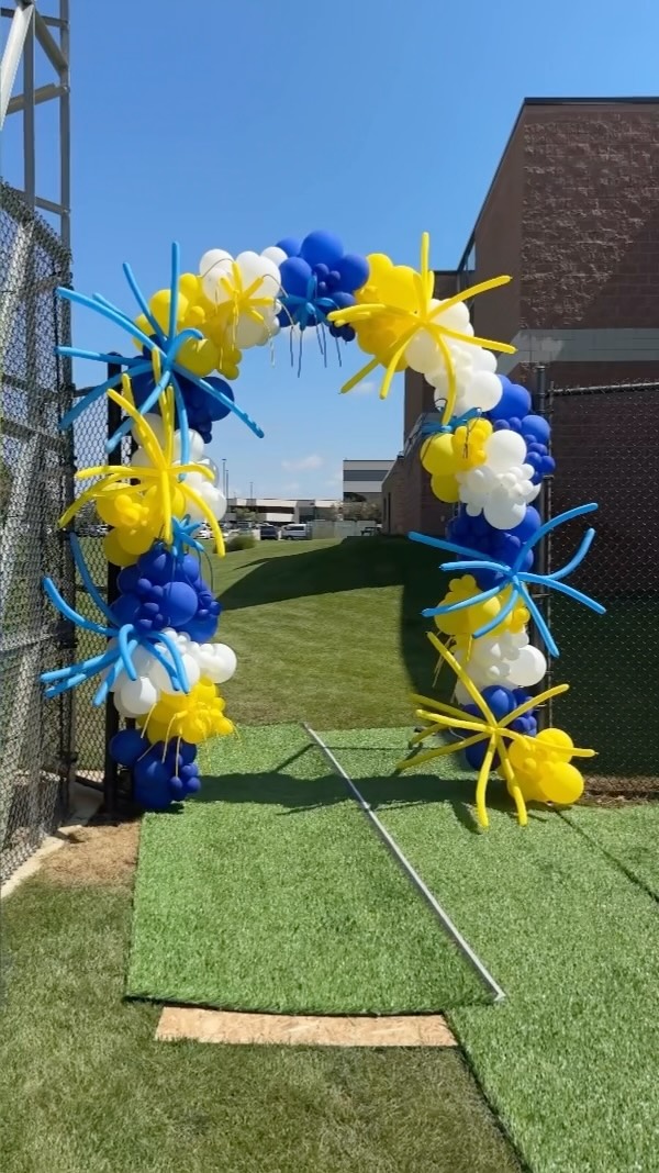 Colorful themed balloon arch welcoming guests to Mustang Mania