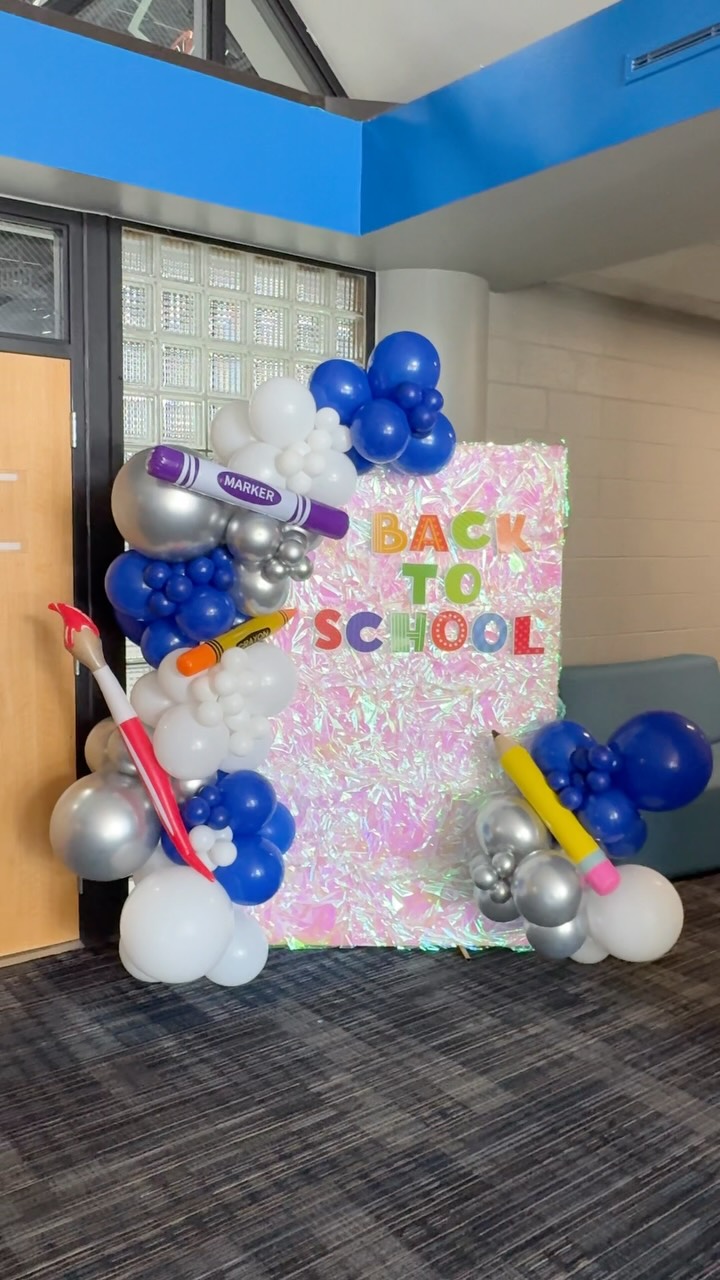 Blue and white back-to-school balloon installation for Tri-Unity Christian